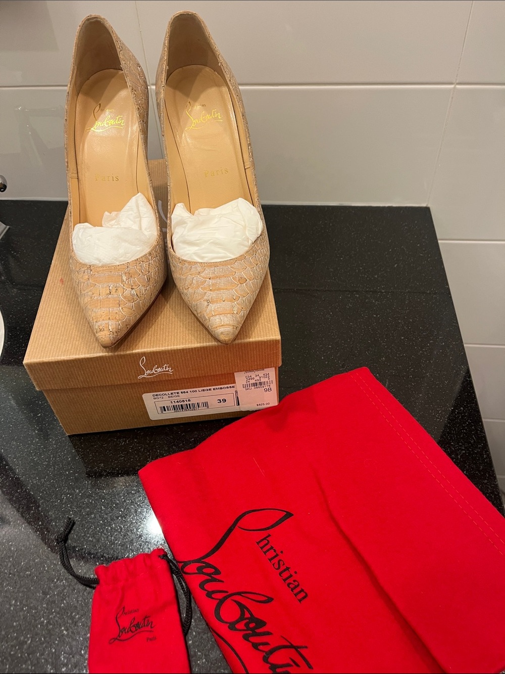 Christian Louboutin snake-print cork pump. Beautiful shoe worn only a few times.
